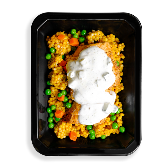I have never seen couscous this full, chicken with a white sauce sits on top of this couscous with green peas and orange carrots filling up this togo container. the colors are vibrant and the food looks very fresh, a perfect meal for someone in a rush or having food delivered and wanting to watch what they eat while not sparing flavors.