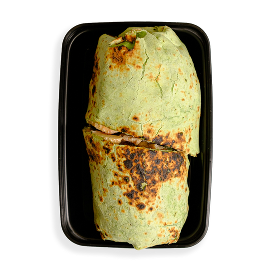 this looks like a green burrito cooked to perfection. the burrito is so big that it barely fits in the black togo container. Its container indicates that this is a healthy prepared meal for someone on the run who wants to both watch what they eat while not depriving themselves of flavor.