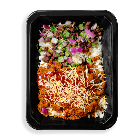 The contents of this container look like a deconstructed taco. I see very flavorful looking ground meat with cheese, salsa, beans, cilantro and onion on top of white rice. This meal looks extremely tasty but I notice it is lacking the cheap carbs typically of the tortilla in a taco or burrito. Clearly the contents of this to-go container is focused on health while appearing not to lack any flavor.