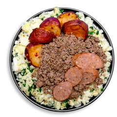 Top-down view of a nutrient-packed breakfast plate showcasing vibrant roasted red potatoes, a bed of scrambled egg whites mixed with leafy spinach, and a generous portion of ground turkey. Boldly garnished with spicy bison jalapeño cheddar sausage slices, this savory and satisfying healthy meal prep option offers rich flavor and clean ingredients for sustained energy.