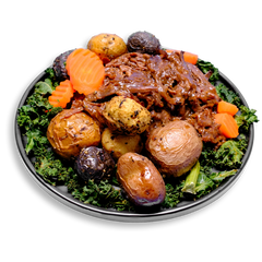 A nutrient-dense, healthy prepared meal showcasing juicy, slow-braised chuck roast pulled into tender shreds and coated in a thick, savory gluten-free gravy. Surrounding the beef are golden-brown roasted marble potatoes and crinkle-cut carrots, all resting atop a bed of vibrant, chopped kale. This high-protein, balanced dish is perfect for clean eating and convenient meal prep with a comfort-food feel.