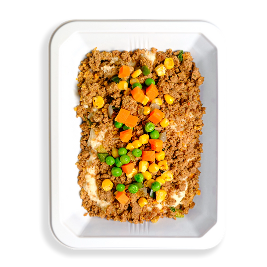 This hearty to-go meal features lean ground bison, red potatoes, and a colorful mix of vegetables like peas, carrots, cauliflower, and corn, all tossed in a savory parmesan and garlic cream sauce. It’s a wholesome twist on the classic British comfort dish, perfect for busy individuals who prefer healthy, ready-made meals—whether delivered or picked up on the go.
