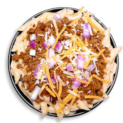 This elevated mac and cheese redefines comfort food: tender gluten-free pasta swirled in a decadent cheese blend of cheddar and parmesan, then generously layered with lean, seasoned ground turkey. Accents of red onion and a dusting of sharp cheddar on top create a colorful contrast and boost flavor. Designed for health food enthusiasts who crave convenience without compromise, this healthy prepared meal is packed with protein and taste.