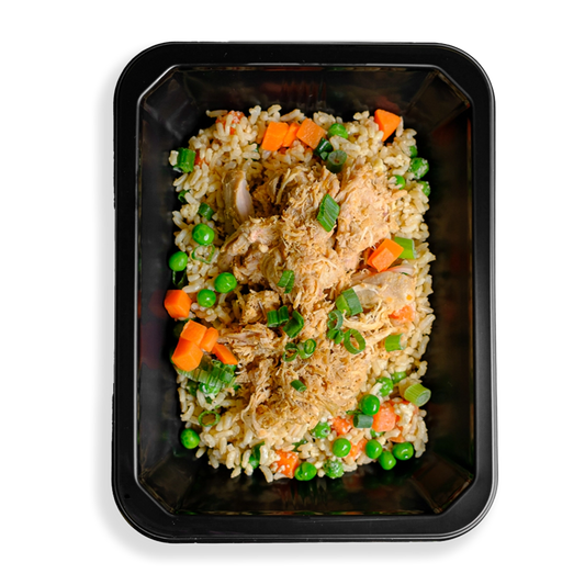 A black container is filled with a healthy version of a classic Chinese fried rice dish.  There is brown rice, chicken thigh, peas, carrots, and green onions filling this container.  The food looks very fresh and colorful.  The fact that the food is in a to-go container signals to me that this is a healthy prepared meal for delivery or pickup from a My Fit Food store location.