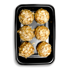 Six wholesome peanut butter protein balls sit in a rectangular to-go container, each covered in layers of toasted oats. Packed with grass-fed whey, coconut, and flaxseed, these no-bake bites deliver sweet, energizing nutrition—a perfect health food solution for pre-workout fuel or afternoon cravings.