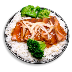 A clean and colorful health prepared meal displayed on a black plate showcasing savory flank steak dressed in a homemade teriyaki sauce made from tamari, garlic, honey, and ginger. Surrounded by steamed white rice and fresh broccoli crowns, the dish is finished with sliced onions for an aromatic kick. This healthy prepared meal is a flavorful blend of protein, fiber, and wholesome ingredients.