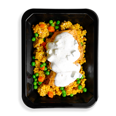 I have never seen  couscous this full, chicken with a white sauce sits on top of this  couscous with green peas and orange carrots filling up this togo container. the colors are vibrant and the food looks very fresh, a perfect meal for someone in a rush or having food delivered and wanting to watch what they eat while not sparing flavors.