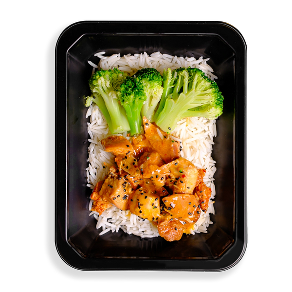 this looks like the best chinese food i have ever seen, what makes it different is that it looks so clean and healthy. broccoli stalks and orange colored chicken sit on top of a bed of white rice filling up this black togo container.  everything looks clean and seasoned well making it a perfect health prepared meal for people wanting both flavor and healthy eating.