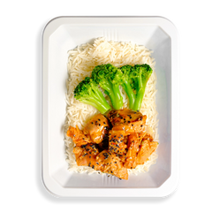 This might be the freshest take on Chinese food I’ve ever seen—what really sets it apart is how clean and wholesome it looks. Tender orange-glazed chicken and crisp broccoli stalks are served over a fluffy bed of white rice, all neatly packed into a white to-go container. Everything appears well-seasoned and thoughtfully prepared, making it an ideal healthy meal option for those who crave bold flavor without sacrificing nutrition.