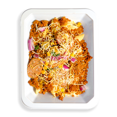 This to-go container is packed with a flavorful mix of textures and vibrant colors. A hearty blend of lean ground turkey, natural pork, and bison sits alongside pasta and a medley of mixed vegetables, including fire-roasted corn and poblano peppers. Topped with a sprinkle of shredded yellow and white cheese, this satisfying, protein-rich meal is perfect for anyone looking to eat well on the go without compromising on taste.