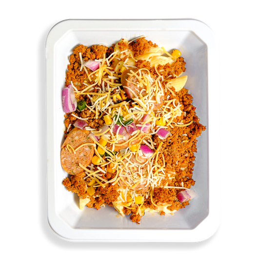 This to-go container is packed with a flavorful mix of textures and vibrant colors. A hearty blend of lean ground turkey, natural pork, and bison sits alongside pasta and a medley of mixed vegetables, including fire-roasted corn and poblano peppers. Topped with a sprinkle of shredded yellow and white cheese, this satisfying, protein-rich meal is perfect for anyone looking to eat well on the go without compromising on taste.