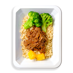 Two extremely green broccoli stalks alongside pulled beef with pineapple pieces are on a bed of brown rice in a white to-go container.  This food looks both very healthy and very flavorful all at ones.  The container the food is in makes me think this healthy meal is prepared for delivery or for instore pickup.