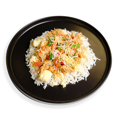 A vibrant healthy prepared meal plate served on a sleek black plate, featuring fluffy white rice topped with tender shredded chicken thigh, scrambled egg pieces, and a colorful pico de gallo mix of tomatoes, red onion, cilantro, and jalapeño. A light sprinkle of cheddar jack cheese melts into the dish, making it a balanced, protein-rich breakfast scramble perfect for healthy meal prep.